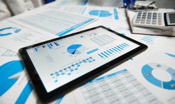 Tablet displaying analytical CRM software at work
