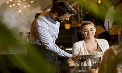 Waiter providing excellent customer service in a restaurant