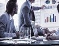 Office workers discussing growth in a meeting