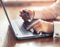 person online shopping using a credit card