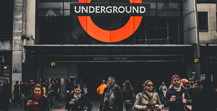 Commuters outside Brixton underground station