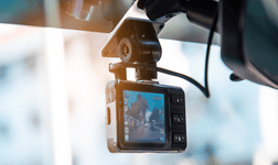 Dash cam attached to a car interior mirror