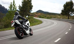 Motorbike turning a corner on the motorway