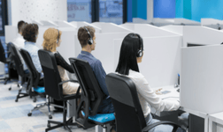 A group of employees working in a call center.