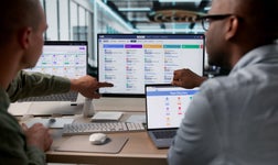 Office workers processing payroll