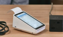 square terminal on a wooden table