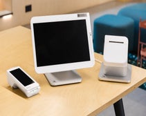 Clover terminal, receipt printer, and Clover Flex card machine on desk