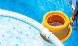 slightly dirty swimming pool needing a service