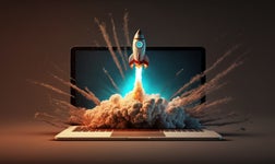 An illustration of a rocket blasting out of a computer screen.