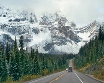 A road leading into a mountainous landscape