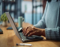 person on laptop setting up a website