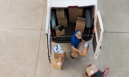 aerial shot of courier delivering packages