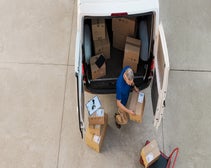 aerial shot of courier delivering packages