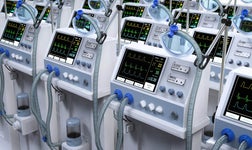 Ventilator machines lined up in storage