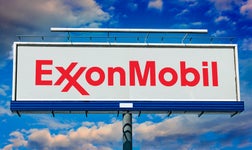 The exxon mobil logo on a sign