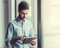 Person using asset tracking software on a tablet