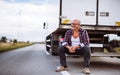 Man sitting at the back of a truck