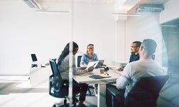 A group of colleagues participating in a meeting