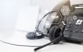 deskphone with headset and overlayed voip logos