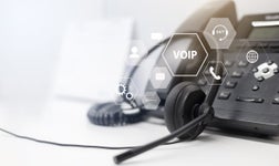 deskphone with headset and overlayed voip logos