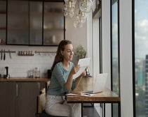 woman looking at paper
