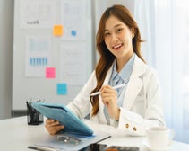 SEO audit cost professional woman holding tablet