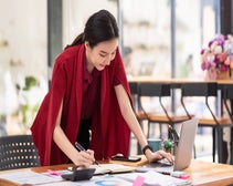 office worker using SEO audit tools on laptop