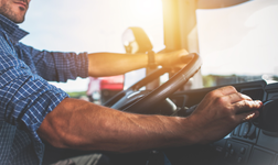 driver hand adjusting vehicle settings