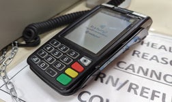 barclaycard reader on a desk