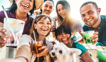 smiling people and one dog taking a selfie
