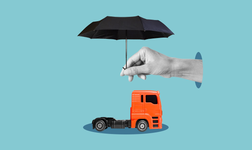 hand holding an umbrella over a truck