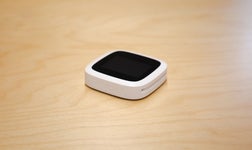 the Revolut card reader pictured on a wooden table.