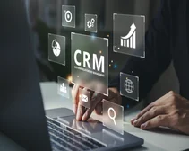 Hand using laptop and press screen to search CRM information on the Internet online