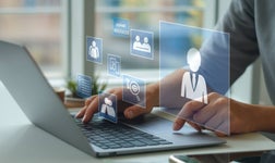 Person using laptop manages human resources digitally