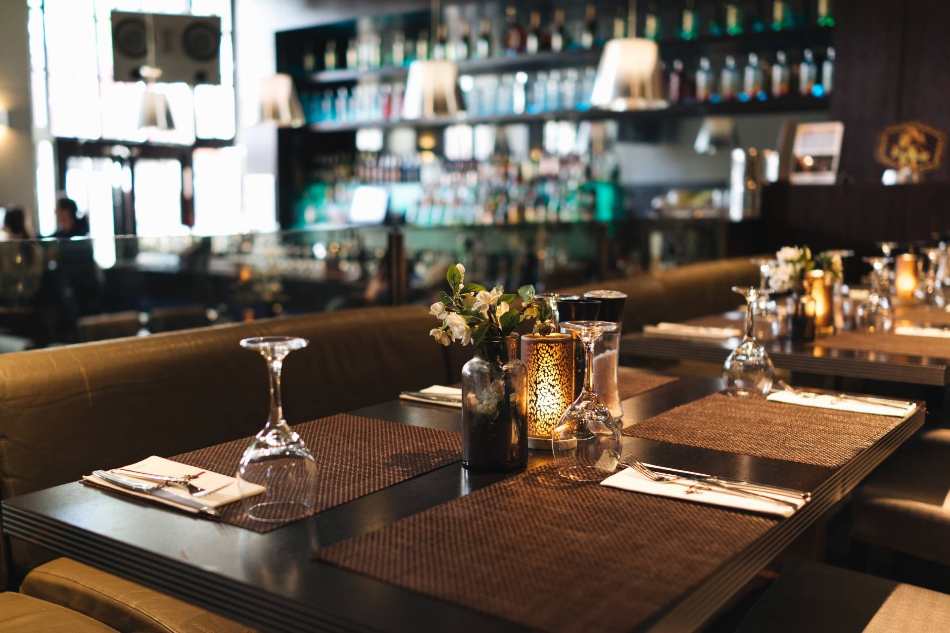 Restaurant setting with a set table in the foreground