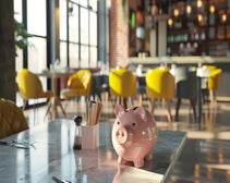 Piggy bank payroll on a table in a restaurant