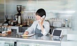 restaurant chef worker on the phone in a restaurant
