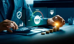 A person sat at a desk with a calculator, working out the risks.