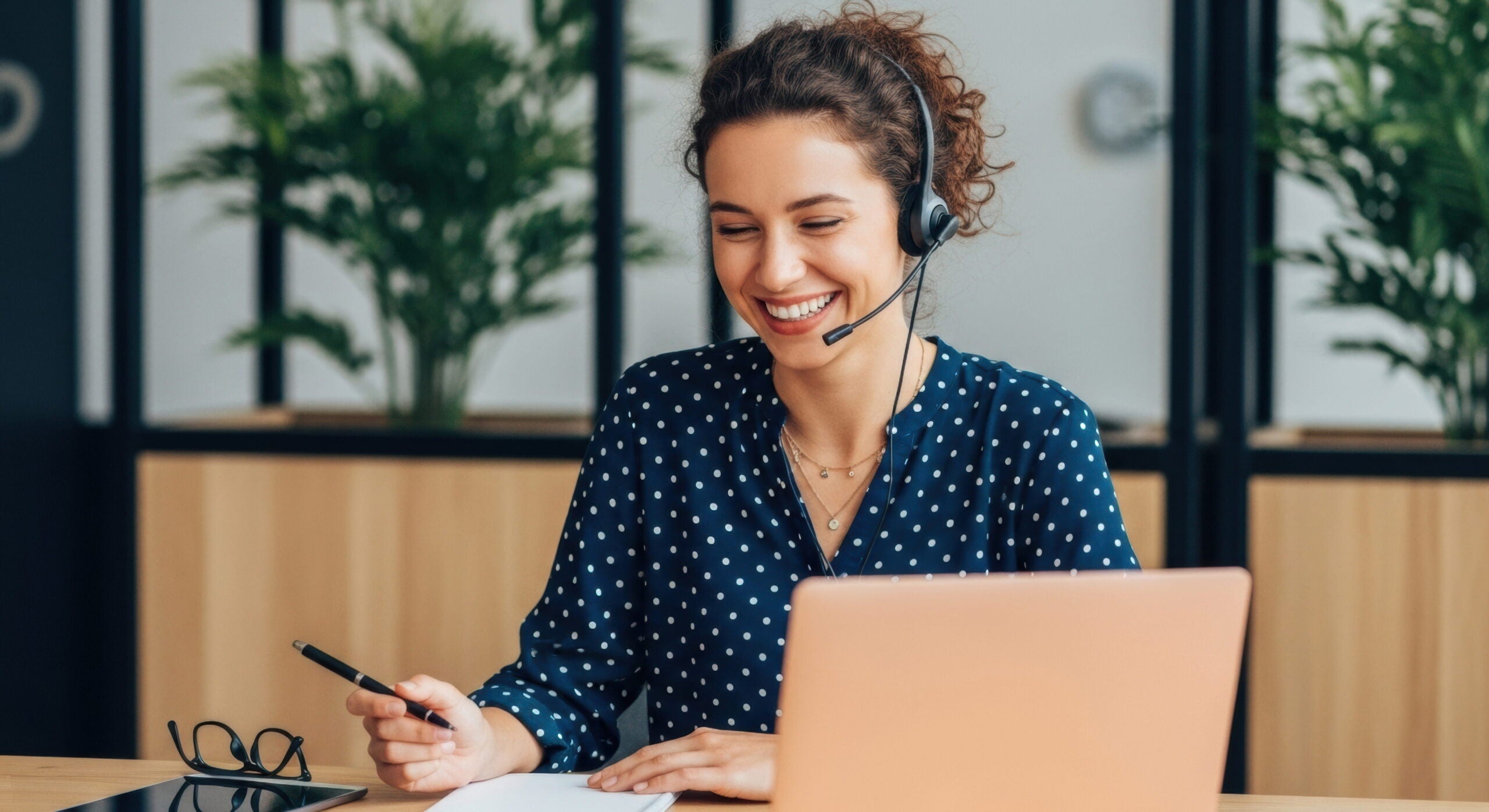Worker using a VoIP system in the office