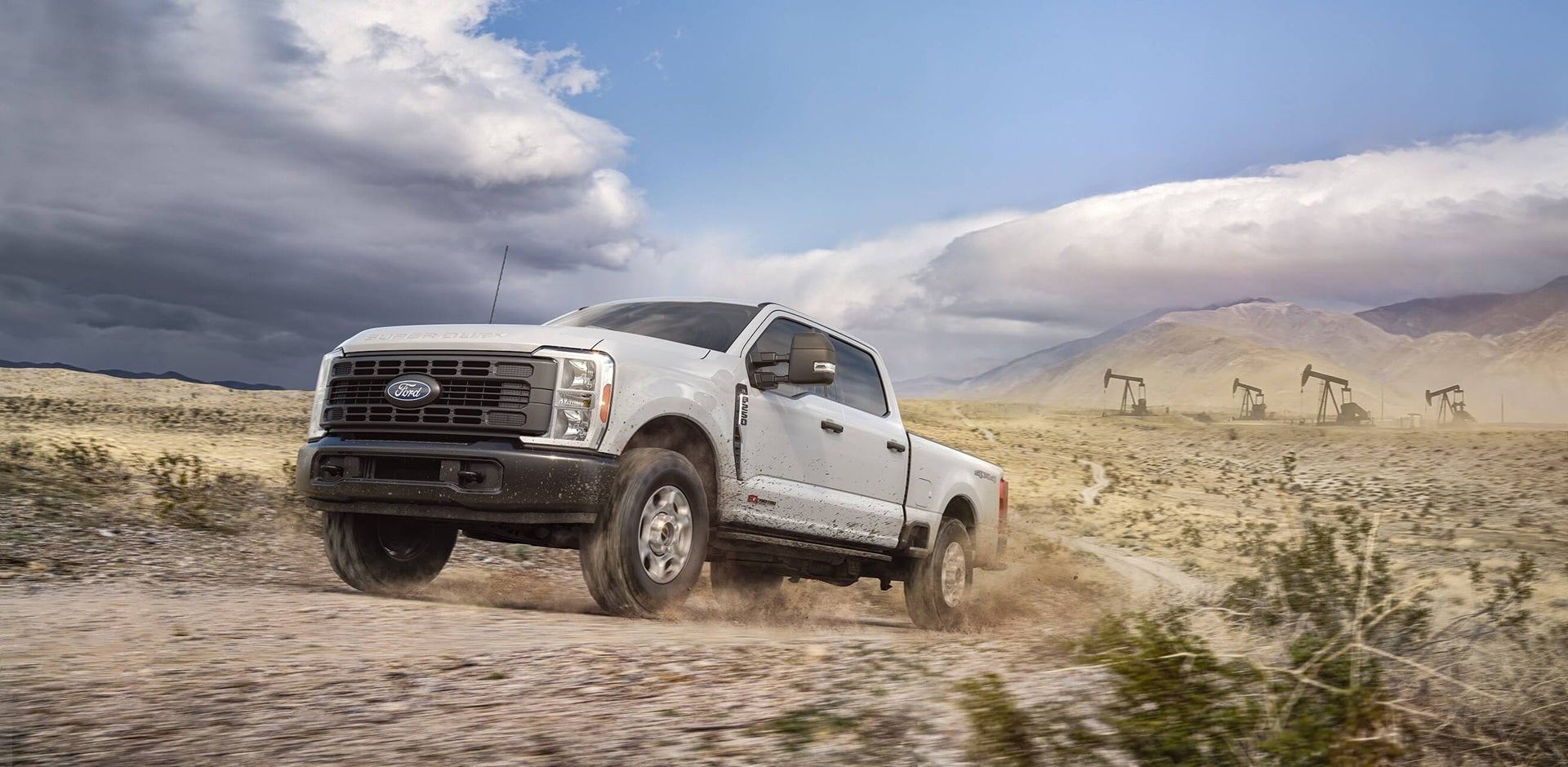 A Ford Super Duty truck drives off-road.